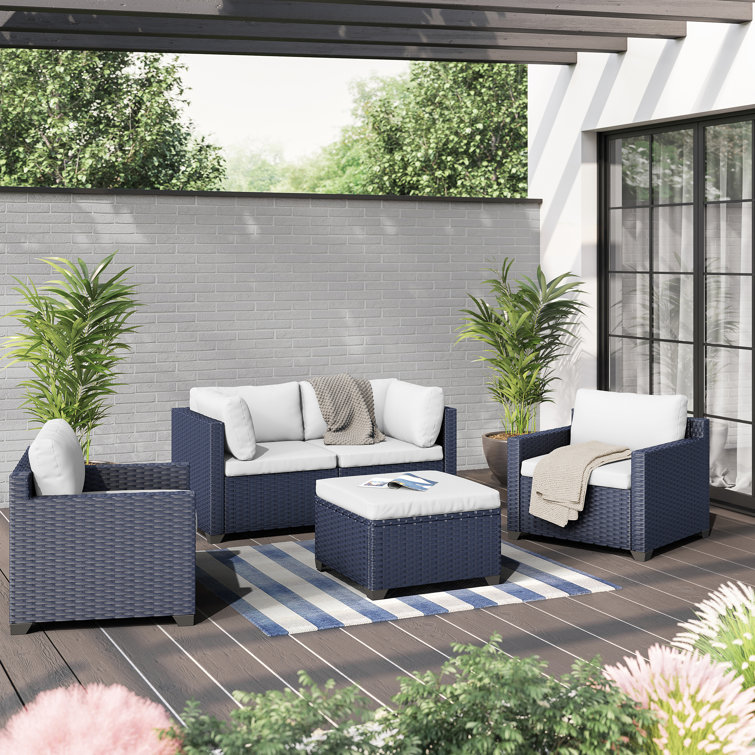 Outdoor loveseat discount and ottoman set